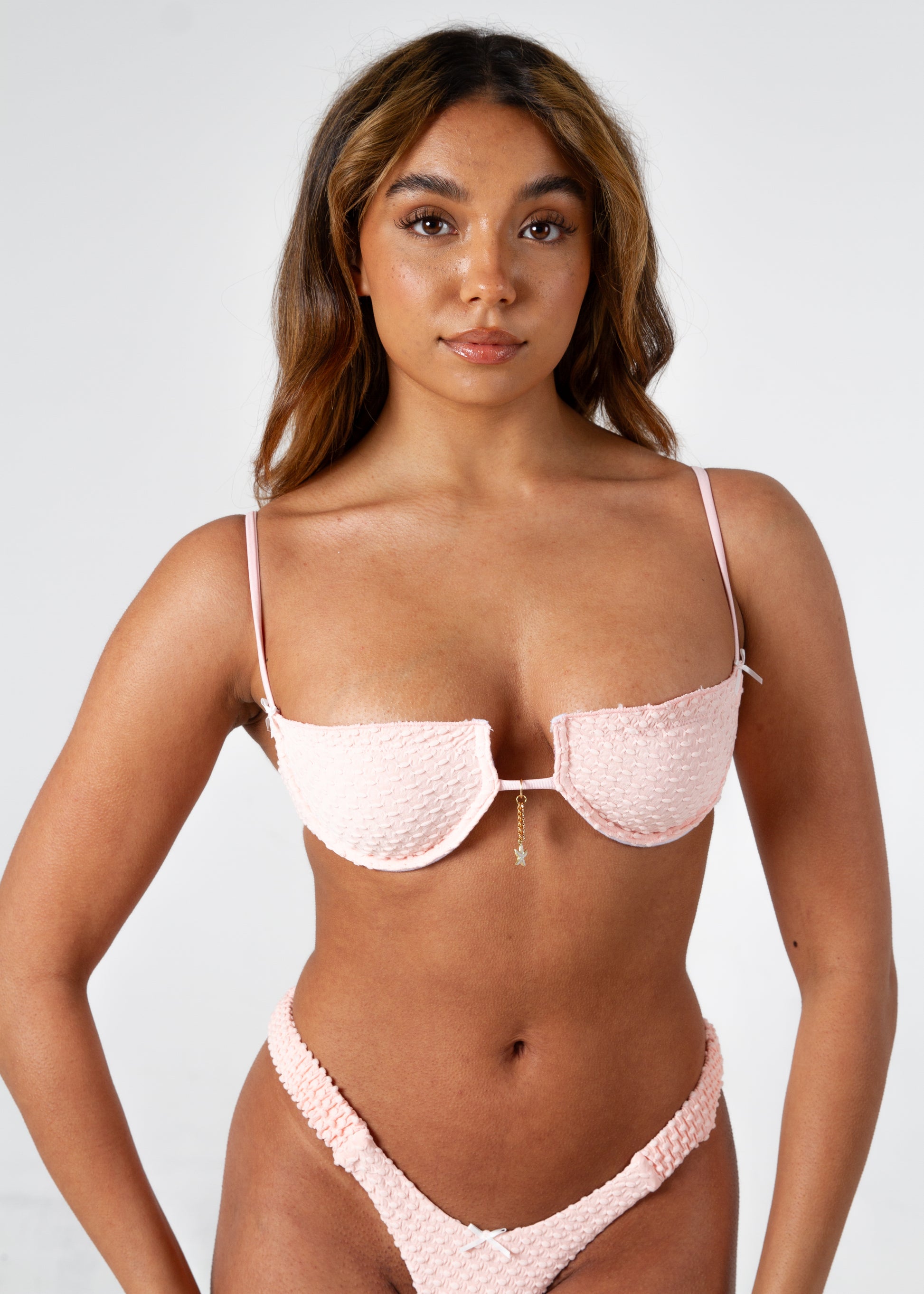 Emilia Pink Textured Push Up Padded Balcony Bikini Top on gorgeous model - front