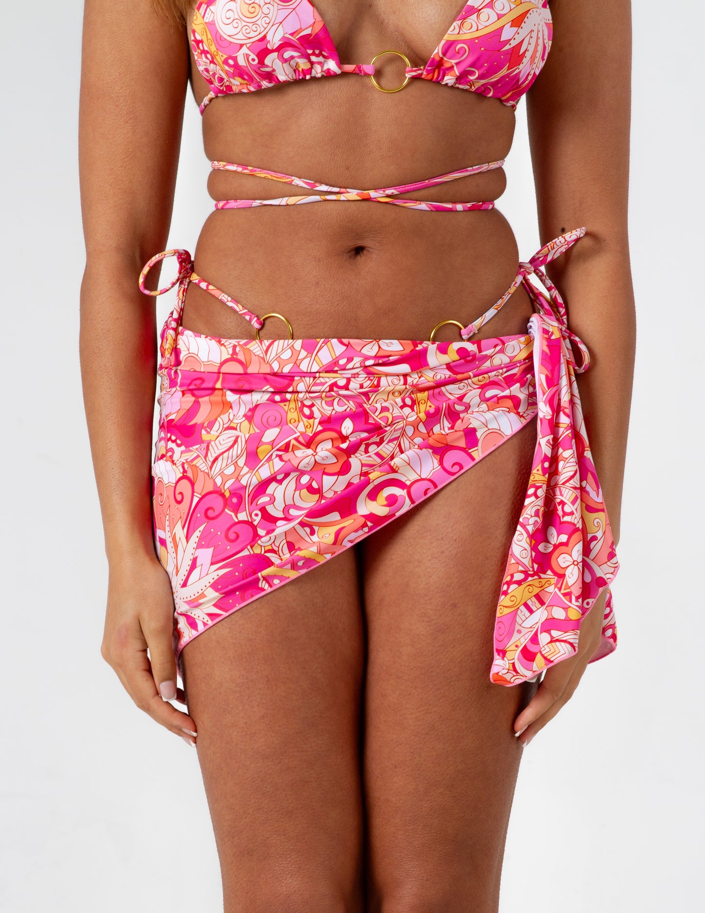 Beautiful vibrant pink printed sarong adjustable tie and coverage on our gorgeous model. Front close up