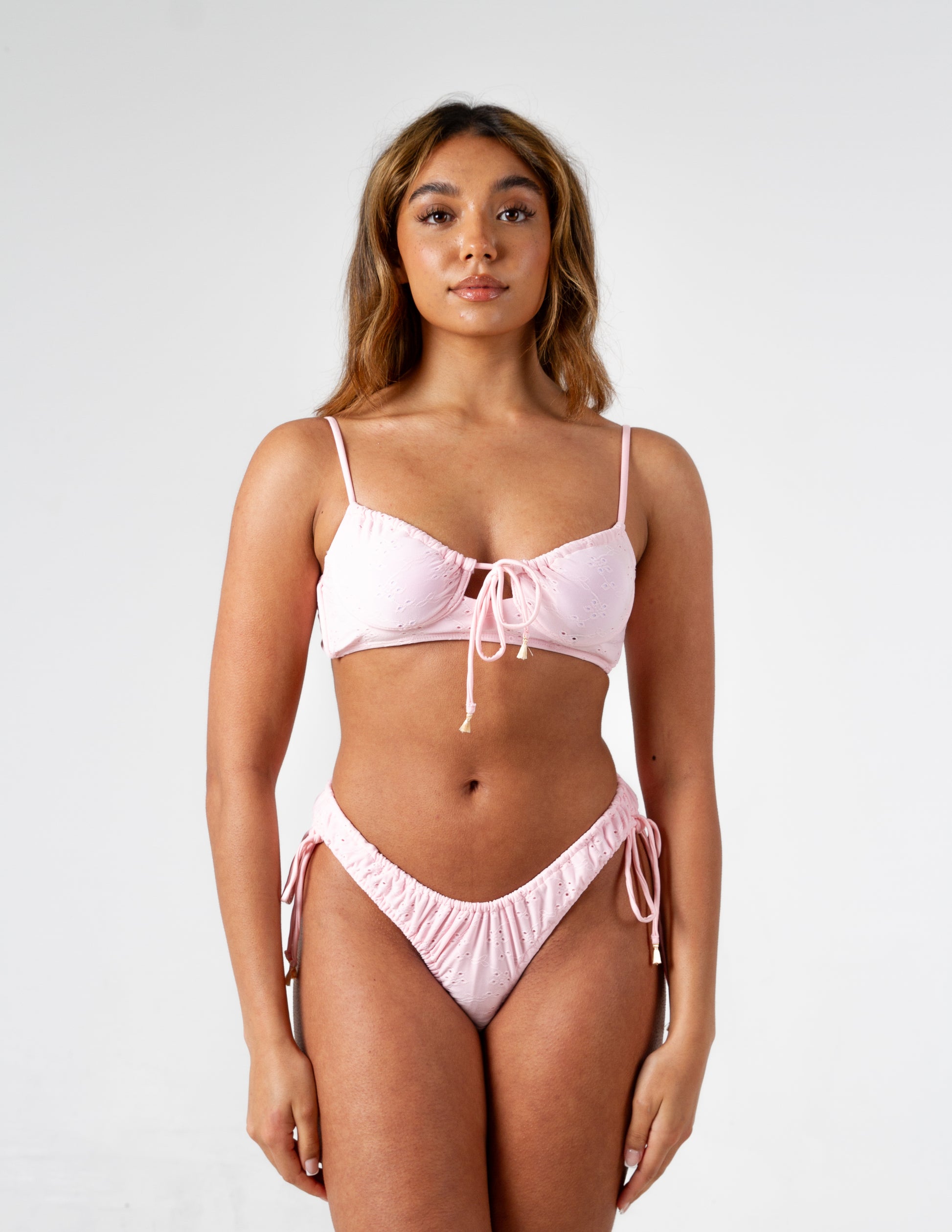 Dolly Pink Broderie Anglaise Textured Bikini Bottom on gorgeous model - front 